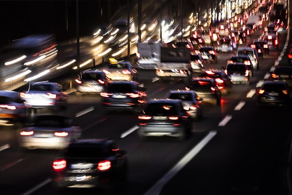 Congested traffic on the A100 looms at blue hour in Berlin