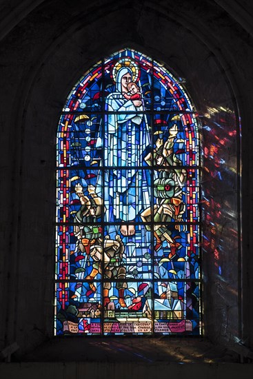 Stained glass window in the Sainte-Mere-Eglise Church depicting the landing of the paratroopers during World War Two in Normandy