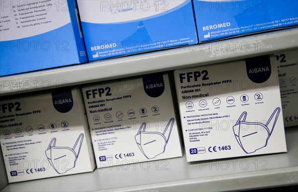 Packed FFP2 masks lying in a compartment in a COVID-19 vaccination and testing centre at Autohaus Olsen in Iserlohn