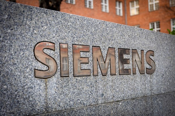 A Siemens company sign in front of a branch office in Siemensstadt in Berlin