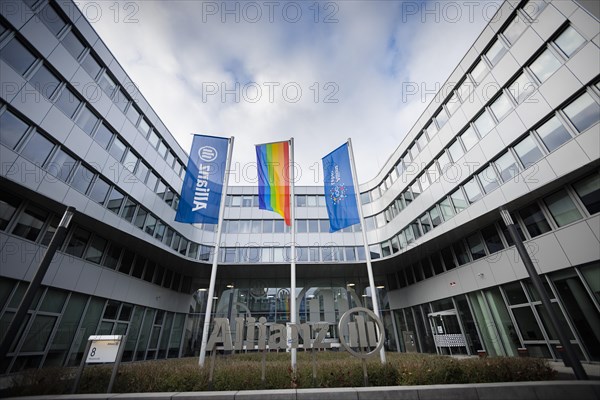 Flags of Allianz stand in front of their location in Berlin. 04.02.2022.