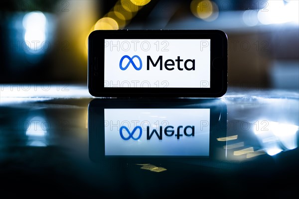 The logo of the technology company Meta stands out on a display in Berlin