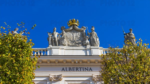 Golden Crown and Marble Statues on the Roof of the Albertina