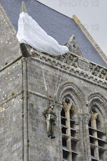 Parachute Memorial in honour of paratrooper John Steele who was caught on the church spire during D-Day