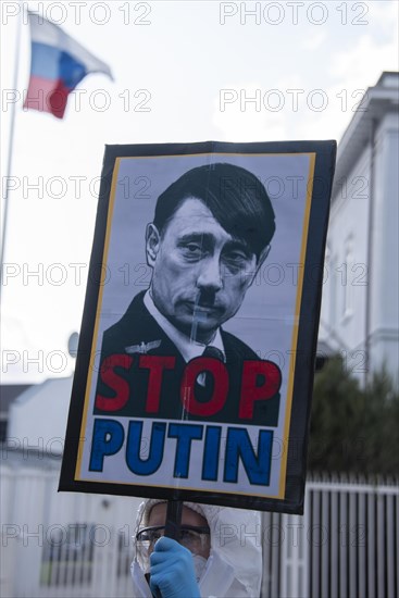 Protest poster in front of Russian embassy