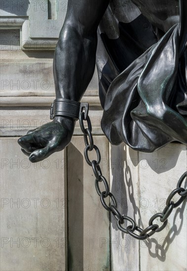 Detail photo of the chained warriors at the base of the equestrian statue of Frederick William of Brandenburg