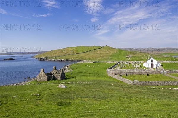 Ruin of old fishing booth and 18th century Lunna Kirk at East Lunna Voe