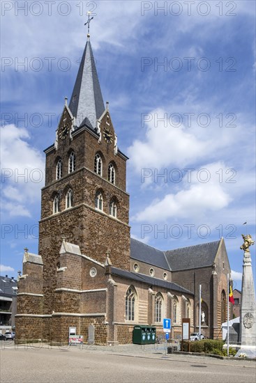 Church and gilded equestrian statue on market square remembering Battle of the Silver Helmets