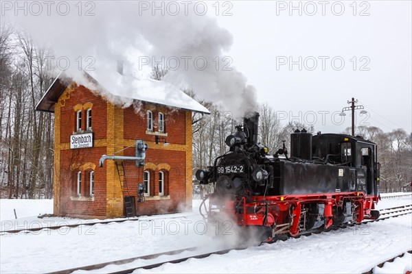 Steam train of the Pressnitztalbahn railway Steam locomotive in winter in Steinbach