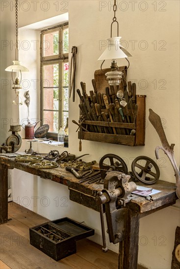 Old workbench with vice and tools