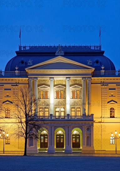 Illuminated Mecklenburg State Theatre in the evening