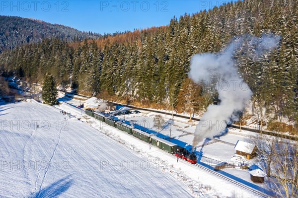 Pressnitztalbahn railway steam train steam locomotive in winter aerial view in Schmalzgrube