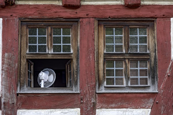 Window with fan to cool the room in hot weather