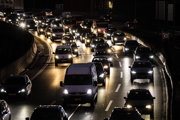 Congested traffic on the A100 looms at blue hour in Berlin