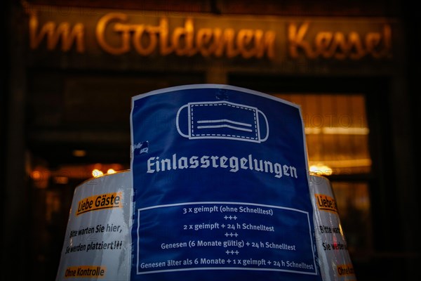 A sign outside a pub indicates the new catering access restrictions to combat the COVID-19 pandemic in Duesseldorf