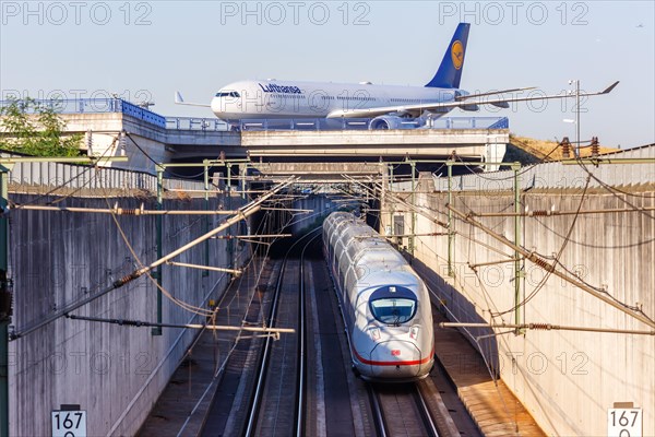 By train to the flight Airbus A330 aircraft of Lufthansa and ICE of Deutsche Bahn at Frankfurt Airport