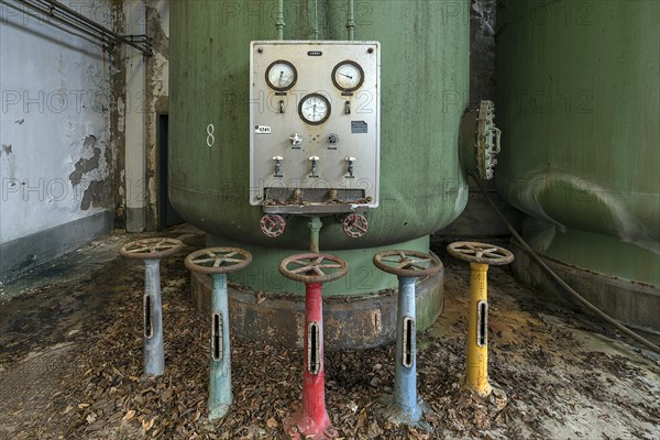 Parking wheels in front of a water tank of the water purification plant in a former paper factory