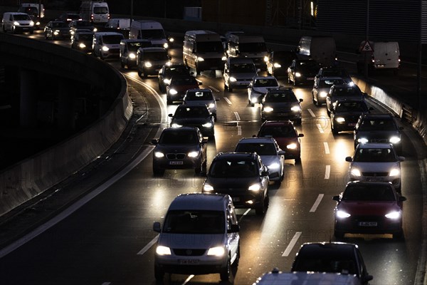 Congested traffic on the A100 looms at blue hour in Berlin