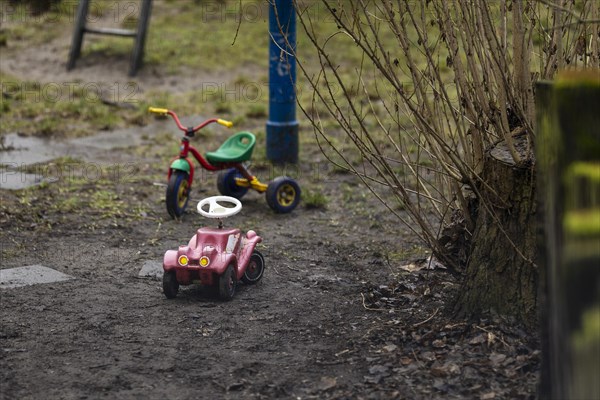 A bobby car and a tricycle