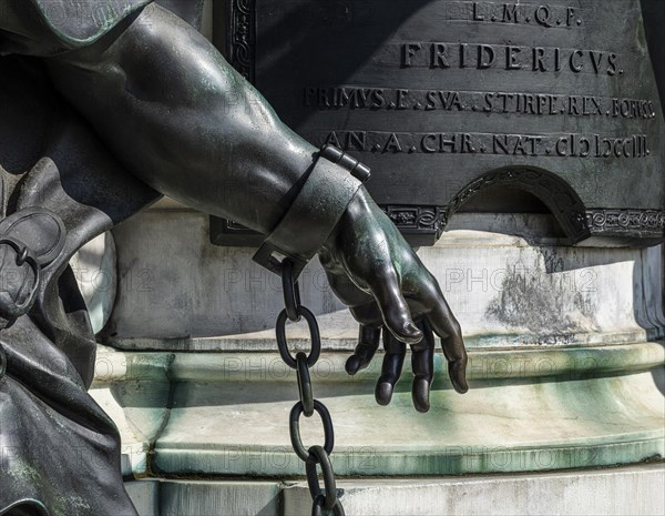 Detail photo of the chained warriors at the base of the equestrian statue of Frederick William of Brandenburg