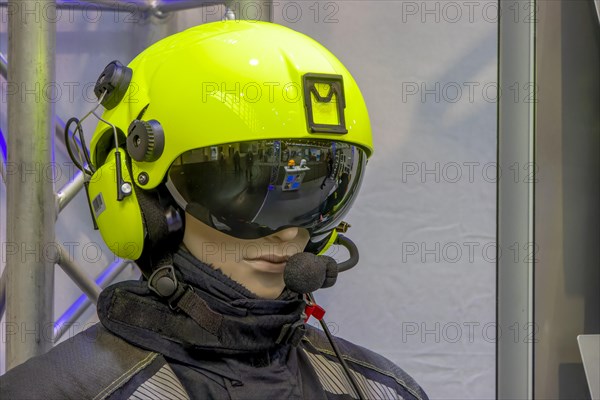 Doll's head with light green pilot's helmet