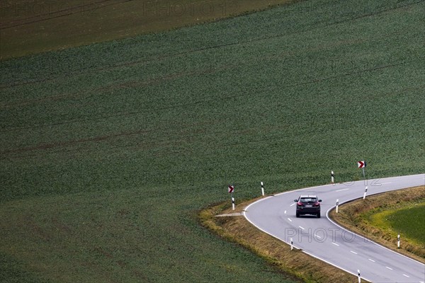 A car driving along a country road in Friedersdorf