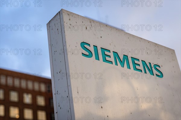 A Siemens company sign in front of a branch office in Siemensstadt in Berlin