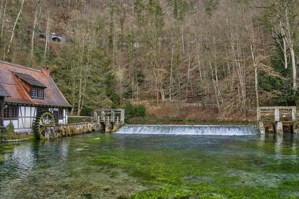 The Blautopf with historic hammer mill in Blaubeuren on the eastern edge of the Swabian Alb near Ulm