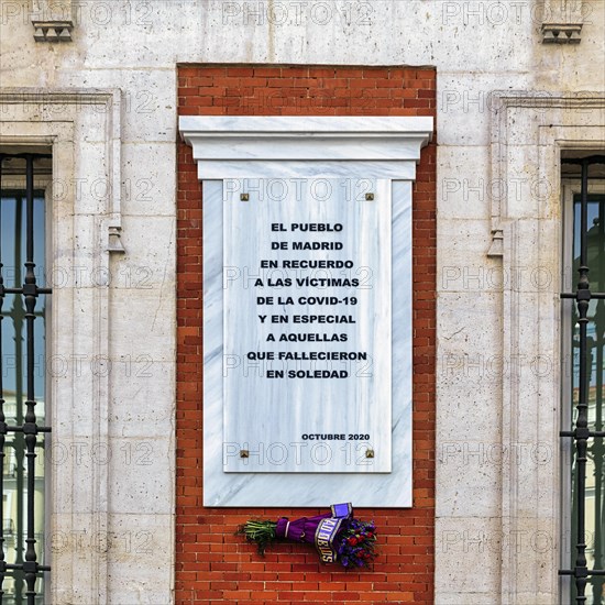 Facade detail with memorial plaque for the victims of the Covid 19 pandemic