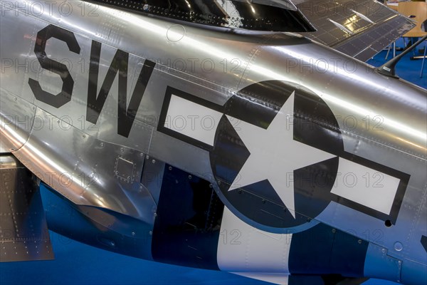 The central part of the aircraft with the American emblem with a star and the inscription SW