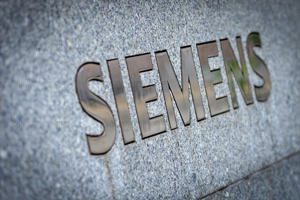 A Siemens company sign in front of a branch office in Siemensstadt in Berlin