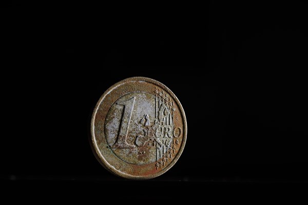 Symbol photo: Weathered 1 euro coin on a euro coin.Berlin