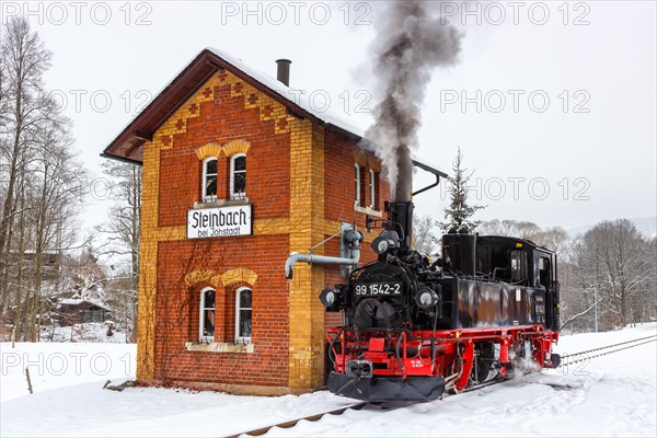 Steam train of the Pressnitztalbahn railway Steam locomotive in winter in Steinbach