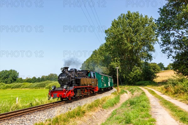 Steam train Rasender Roland railway steam locomotive on the island of Ruegen in Serams