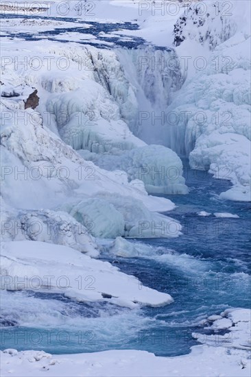 Gullfoss waterfall in the snow in winter located in the canyon of Hvita river