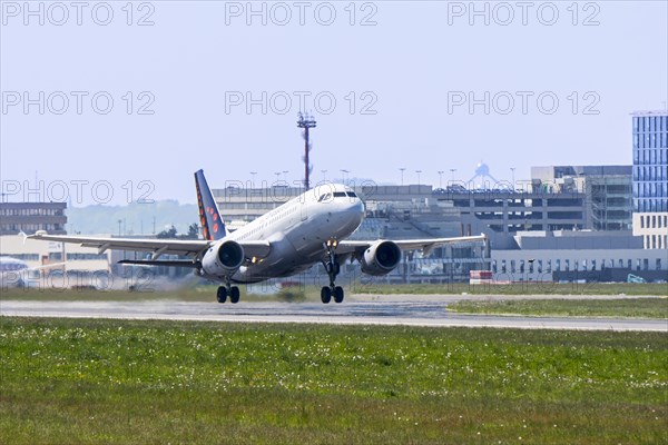 Airbus A319-111 from Brussels Airlines taking off from runway at the Brussels-National airport