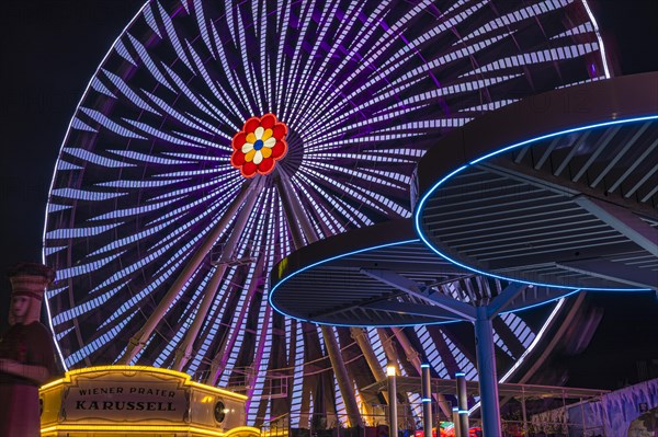 Illuminated flower wheel at the Prater