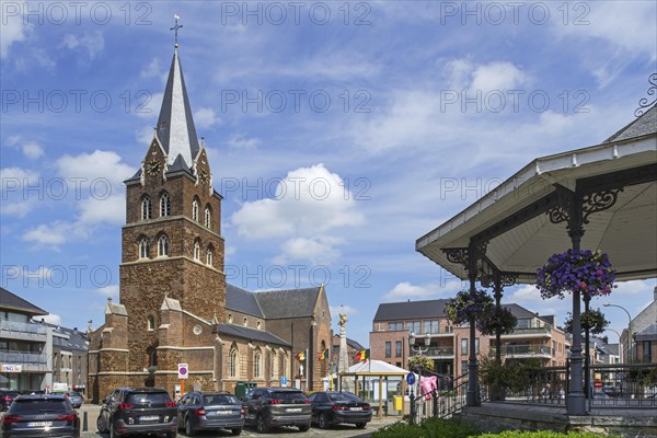 Church and gilded equestrian statue on market square remembering Battle of the Silver Helmets