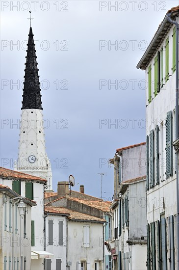 Black and white spire of the church of Saint Etienne serves as beacon for ships in Ars-en-Re on the island Ile de Re