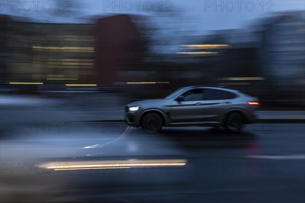 An SUV stands out in the evening in Berlin