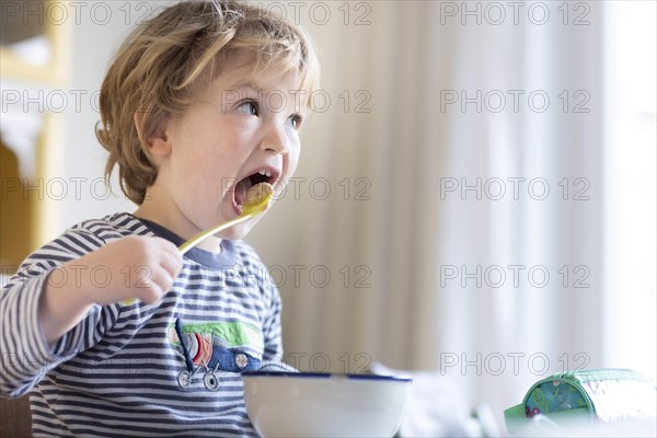 Subject: Toddler having breakfast