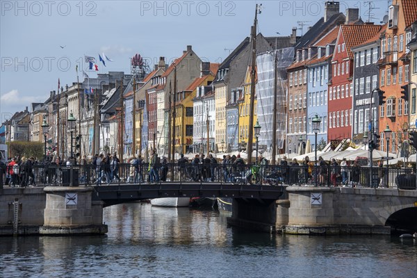 Tourists crossing bridge