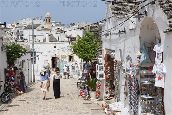 Tourist women between trulli