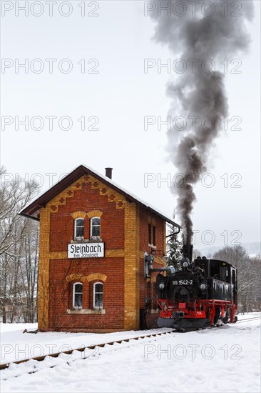 Steam train of the Pressnitztalbahn railway Steam locomotive in winter in Steinbach