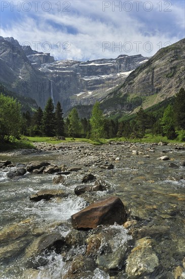 Mountain stream running through the Cirque de Gavarnie and the Gavarnie Falls