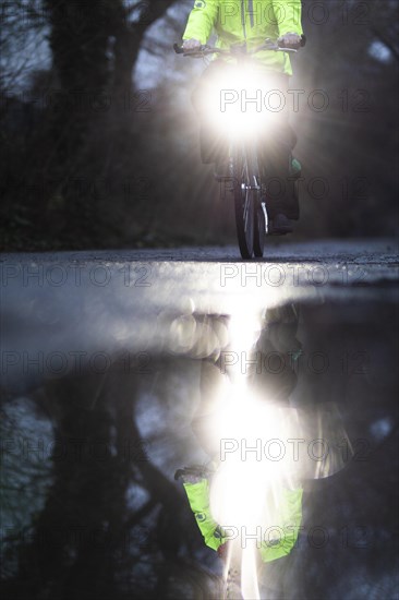 A man rides his bicycle along the Teltow Canal in Berlin