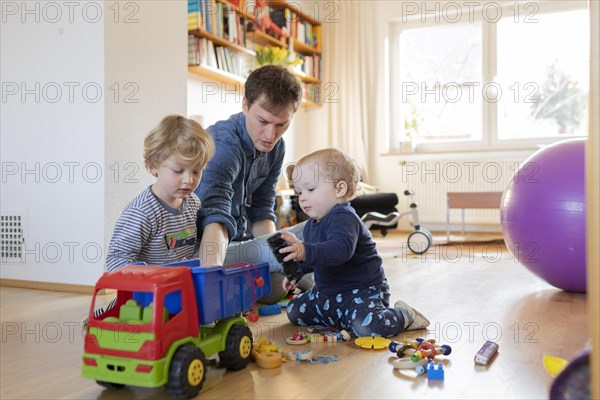 Subject: Father with two children aged nine months and three years.