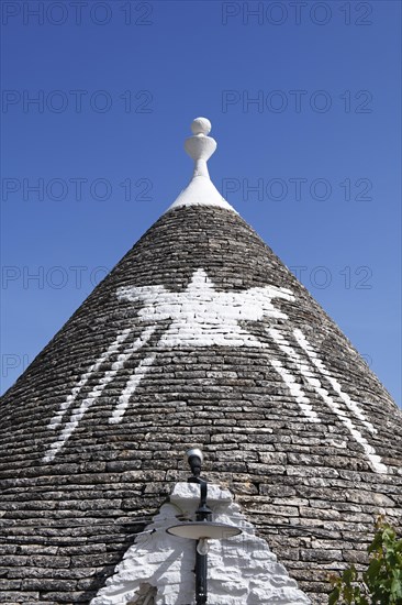 Trulli with symbol on the roof