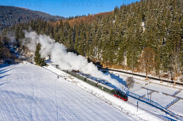 Pressnitztalbahn railway steam train steam locomotive in winter aerial view in Schmalzgrube