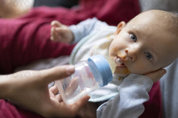 Child being fed with water